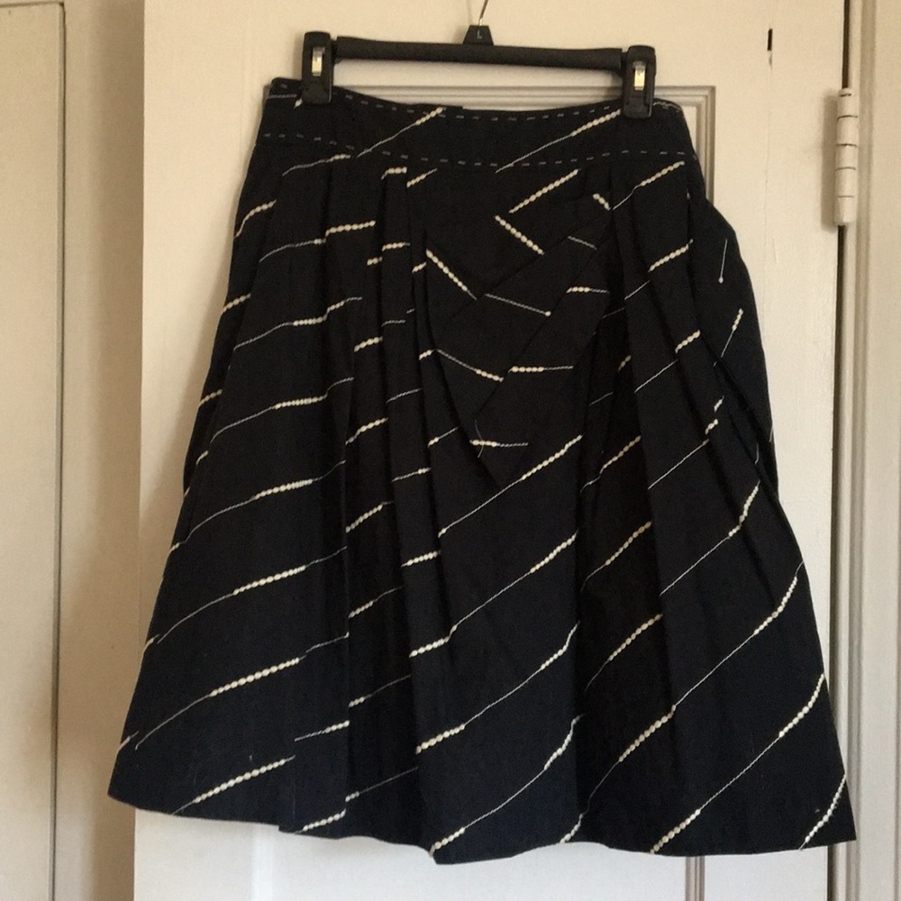 Black a-line skirt with tulle underlay.